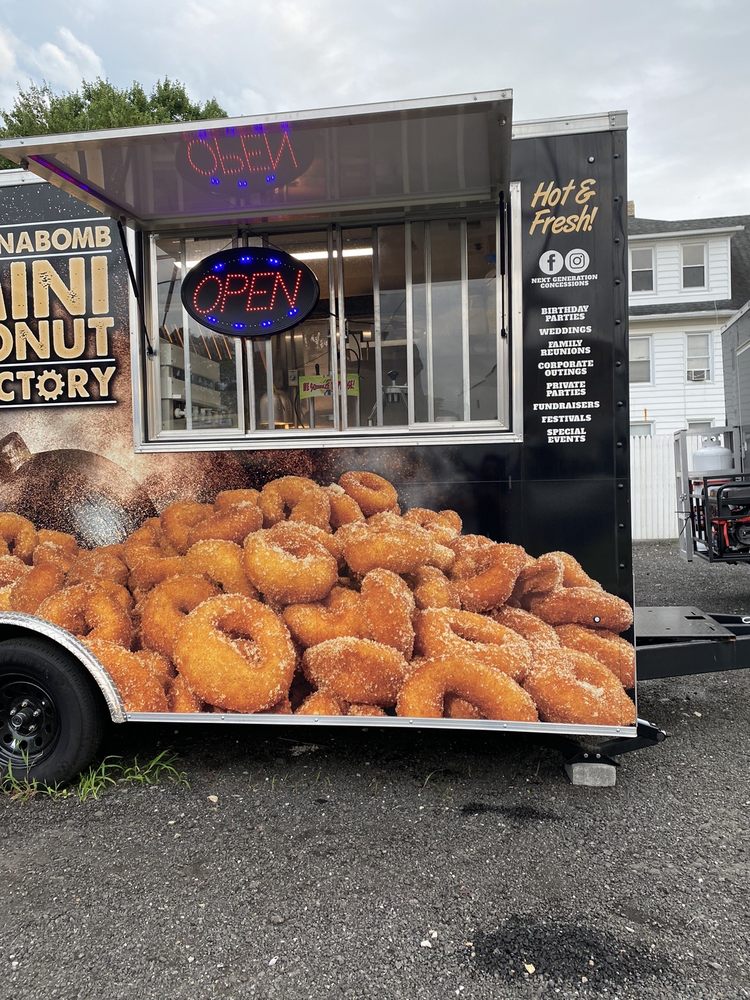 The Cinnabomb Mini Donut Factory Logo
